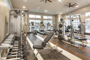 Gym with Free Weights at Colorado Springs Apartments near the Promenade Shops at Birargate